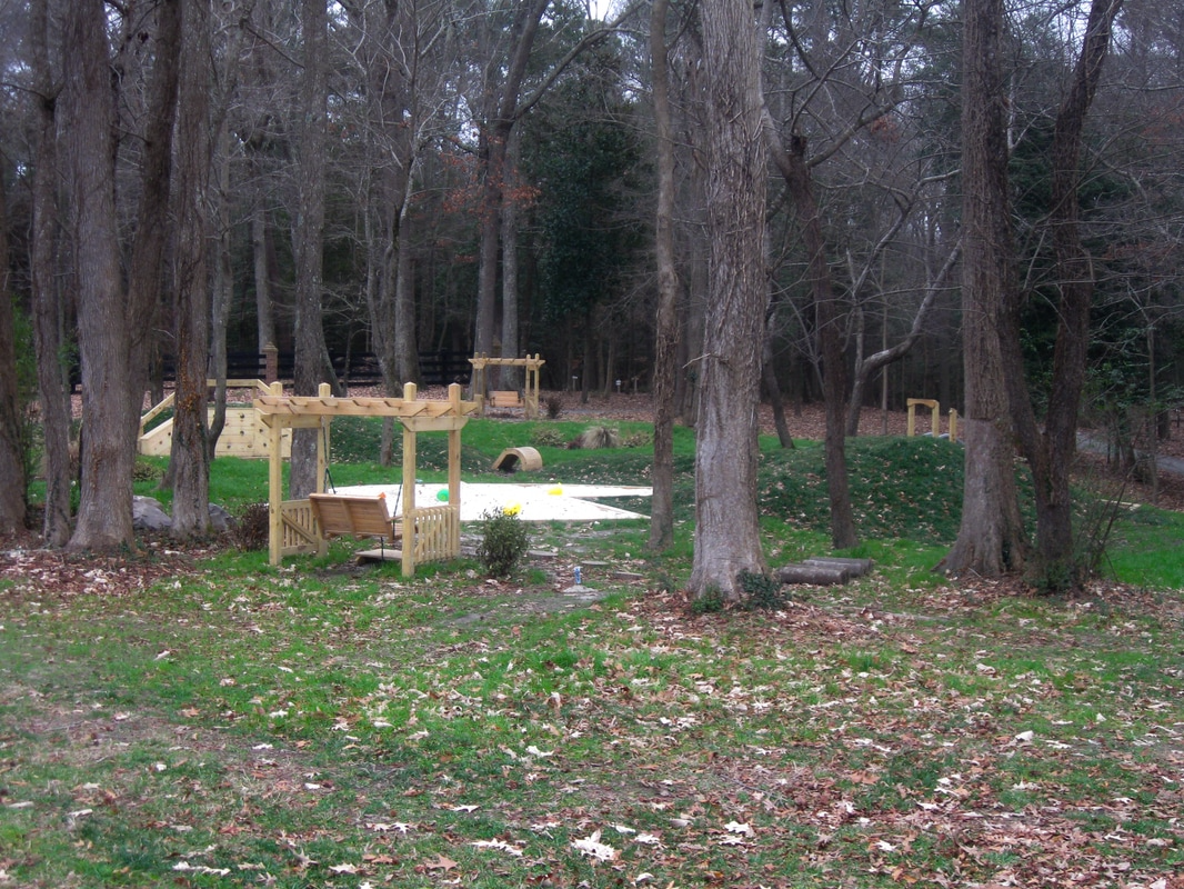Swinging Benches Overlooking Play Area